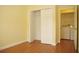 Bedroom has closet with full doors and adjacent laundry area at 415 N Fern Creek Ave, Orlando, FL 32803