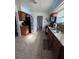 Traditional kitchen with tile floors, granite countertops, wood cabinets, and stainless steel refrigerator at 415 N Fern Creek Ave, Orlando, FL 32803