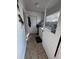 Laundry room with washer, dryer, tile floor, and white painted walls at 415 N Fern Creek Ave, Orlando, FL 32803