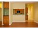 Open living space with light wood floors and pass through to kitchen at 415 N Fern Creek Ave, Orlando, FL 32803