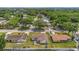 Aerial view of the property and neighborhood, highlighting the fenced yard, mature trees, and residential area at 4636 Mesa Verde Dr, St Cloud, FL 34769
