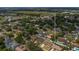Overhead shot highlighting property location in a mature, tree-lined neighborhood near open green spaces at 4636 Mesa Verde Dr, St Cloud, FL 34769