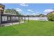 Spacious backyard features a covered patio and lush green lawn at 4636 Mesa Verde Dr, St Cloud, FL 34769