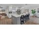 Modern kitchen featuring a large center island, white cabinets, and stainless steel appliances at 4636 Mesa Verde Dr, St Cloud, FL 34769