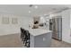 Modern kitchen with a large center island, stainless steel appliances, and open concept design at 4636 Mesa Verde Dr, St Cloud, FL 34769