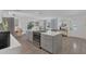 Spacious kitchen featuring a large island, modern appliances, and an open layout to the dining and living areas at 4636 Mesa Verde Dr, St Cloud, FL 34769