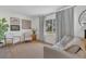 Bright and airy living room with neutral decor, a large window, and comfortable seating at 4636 Mesa Verde Dr, St Cloud, FL 34769