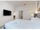 Inviting bedroom with plush bedding, large television, and ample closet space at 485 Famagusta Dr, Davenport, FL 33896