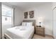 Cozy bedroom with modern decor, a comfortable bed, and natural light at 485 Famagusta Dr, Davenport, FL 33896