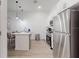 A modern kitchen featuring stainless steel appliances and a stylish island at 485 Famagusta Dr, Davenport, FL 33896