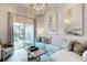 Cozy living room with stylish decor, comfortable seating, and access to a backyard patio at 485 Famagusta Dr, Davenport, FL 33896