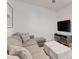 Cozy living room with comfortable seating, TV, and stylish decor at 485 Famagusta Dr, Davenport, FL 33896