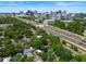 Aerial view showing the property's location, access to highway, and the skyline of the nearby city at 506 S Hyer Ave, Orlando, FL 32801