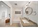 Modern bathroom with granite counters, tile accents, and tub, providing a luxurious experience at 506 S Hyer Ave, Orlando, FL 32801