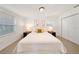 Bright bedroom featuring a neutral color palette, two windows, and a closet for ample storage at 506 S Hyer Ave, Orlando, FL 32801