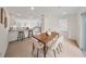 Modern dining room adjacent to kitchen includes counter seating and outdoor access at 506 S Hyer Ave, Orlando, FL 32801