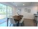 Modern dining room featuring a sliding glass door to the exterior and neutral decor at 506 S Hyer Ave, Orlando, FL 32801