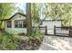 Charming home exterior with a cozy deck area, complemented by lush landscaping, creating great curb appeal at 506 S Hyer Ave, Orlando, FL 32801