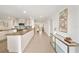 Bright, open-concept kitchen with granite countertops, white cabinetry, and modern appliances at 506 S Hyer Ave, Orlando, FL 32801