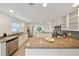 Bright kitchen with granite countertops, stainless steel appliances, and white cabinetry at 506 S Hyer Ave, Orlando, FL 32801