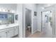 Full bathroom featuring tile floors, vanity with mirror, toilet, and walk-in shower at 509 New Providence, Davenport, FL 33897