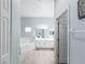 Well-lit bathroom area with tile flooring, a soaking tub, and a double vanity at 509 New Providence, Davenport, FL 33897