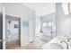 Bright bathroom boasts double sinks, soaking tub, and separate glass-enclosed shower at 509 New Providence, Davenport, FL 33897