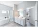 Large bathroom with double sinks, tiled floors, a shower, and a tub at 509 New Providence, Davenport, FL 33897