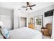 Bright bedroom showcases closet space, ceiling fan, dresser, and outside views at 509 New Providence, Davenport, FL 33897