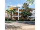 Exterior of the building with trees and a parking lot at 509 New Providence, Davenport, FL 33897