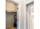 Open closet in the main bedroom next to a bathroom at 509 New Providence, Davenport, FL 33897