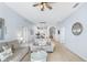 Inviting living room with hardwood floors, neutral walls, and an open layout connected to the dining area at 509 New Providence, Davenport, FL 33897