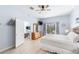 Bright main bedroom featuring a ceiling fan, television, balcony, and access to the main living area at 509 New Providence, Davenport, FL 33897