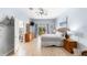 Spacious main bedroom with wood-look flooring, balcony access, a ceiling fan, and light blue walls at 509 New Providence, Davenport, FL 33897