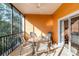 Screened patio with seating, view of natural surroundings at 509 New Providence, Davenport, FL 33897