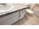 Bright bathroom featuring a modern vanity, sleek countertop, and ceramic tile flooring at 516 Madison Dr, Davenport, FL 33837