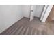 Bedroom with plush carpet, neutral walls, and a closet door at 516 Madison Dr, Davenport, FL 33837