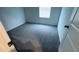 Neutrally decorated bedroom with soft carpet and ample natural light from a window at 516 Madison Dr, Davenport, FL 33837