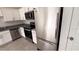 Modern kitchen featuring stainless steel appliances, white cabinets, and granite countertops at 516 Madison Dr, Davenport, FL 33837