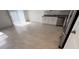 Bright and airy kitchenette area with ample space, stainless steel appliances, and tiled flooring at 516 Madison Dr, Davenport, FL 33837