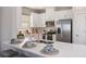 Modern kitchen with stainless steel appliances and a center island with seating at 5333 Spoonflower Ct, St Cloud, FL 34771