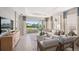 Stylish living room with modern decor, lake view, and comfortable seating at 5333 Spoonflower Ct, St Cloud, FL 34771