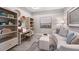 Cozy study featuring a desk, bookshelves, and comfortable sofa at 5333 Spoonflower Ct, St Cloud, FL 34771