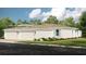 Charming single-story home with a two-car garage, manicured landscaping, and neutral color palette at 5337 Spoonflower Ct, St Cloud, FL 34771