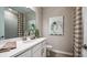 Bathroom featuring a white vanity, toilet, mirror, and shower with curtain at 549 Moon Shell Cir, New Smyrna Beach, FL 32168