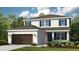 Charming two-story home featuring a well-manicured lawn, attached two-car garage, and lovely blue shutters at 549 Moon Shell Cir, New Smyrna Beach, FL 32168