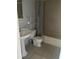 Compact bathroom with tiled floor and sink pedestal at 5926 Peregrine Ave # A13, Orlando, FL 32819