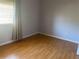 Plain bedroom with laminate floors, a window and simple color scheme at 5926 Peregrine Ave # A13, Orlando, FL 32819