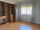Bedroom featuring a window with blinds and large closet with built-in storage at 5926 Peregrine Ave # A13, Orlando, FL 32819
