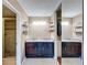 Bathroom showcasing double sink vanity with granite counters and a convenient walk-in shower at 6 Escondido Cir # 64, Altamonte Springs, FL 32701